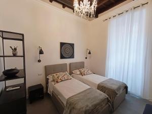 A bed or beds in a room at La tua casa a Piazza del Popolo
