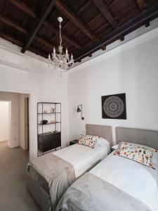 A bed or beds in a room at La tua casa a Piazza del Popolo