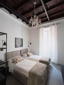 A bed or beds in a room at La tua casa a Piazza del Popolo