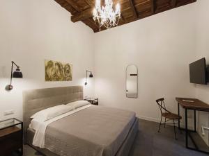 A bed or beds in a room at La tua casa a Piazza del Popolo