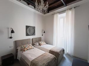 A bed or beds in a room at La tua casa a Piazza del Popolo