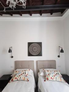 A bed or beds in a room at La tua casa a Piazza del Popolo