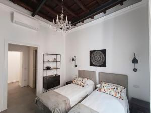A bed or beds in a room at La tua casa a Piazza del Popolo