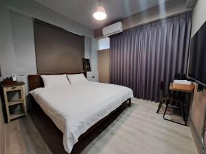 Giường trong phòng chung tại 敘時光行旅 Telling Story House