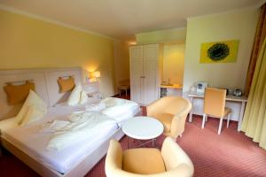 Ein Bett oder Betten in einem Zimmer der Unterkunft Family & Sporthotel Kärntnerhof