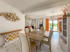 a dining room with a table and chairs at V3, Villa Belo Horizonte near Beach, Albufeira in Albufeira