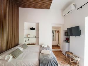 A bed or beds in a room at Mini Studio con Balcone a Piazza del Popolo