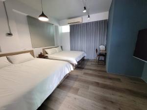 Giường trong phòng chung tại 敘時光行旅 Telling Story House