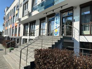 a building with stairs in front of a building at MISTO capsule hotel in Kyiv