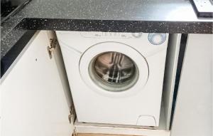 a washing machine with a counter top above it at Lovely Apartment In Gdynia With Wi-fi in Gdynia