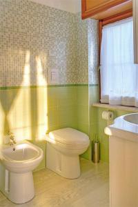 a bathroom with a toilet and a sink at Residenza Guglielmi in Campobasso