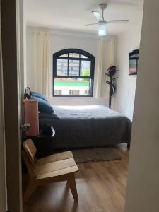 En eller flere senge i et værelse på Espaço acolhedor, no Guarujá