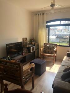 Et opholdsområde på Espaço acolhedor, no Guarujá + 40 billeder