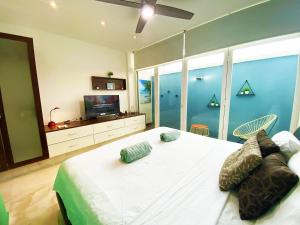 Postel nebo postele na pokoji v ubytování Suite La Playita - Cerca de 5ta Av y Playa + 37 fotografií