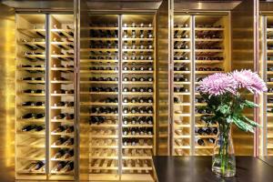 a wine cellar with a table and a vase of flowers at Best Western Plus Sthlm Bromma in Stockholm
