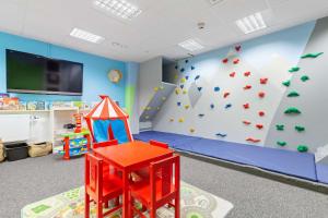 a kids room with a climbing wall and a rock wall at Best Western Plus Sthlm Bromma in Stockholm