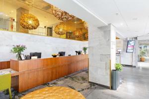 a lobby of a hotel with a reception desk at Best Western Plus Sthlm Bromma in Stockholm