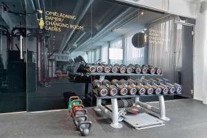a gym with a bunch of dumbbells on a rack at Best Western Plus Sthlm Bromma in Stockholm