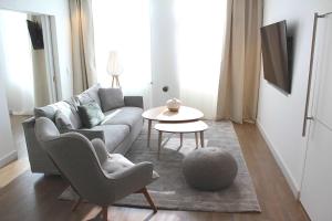 a living room with a couch and a table at Best Western Plus Sthlm Bromma in Stockholm