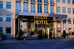 a hotel with a sign on the front of a building at Best Western Plus Sthlm Bromma in Stockholm