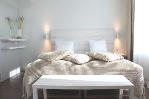 a bedroom with a bed with pillows on it at Best Western Plus Sthlm Bromma in Stockholm