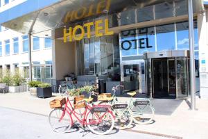 two bikes parked in front of a hotel at Best Western Plus Sthlm Bromma in Stockholm