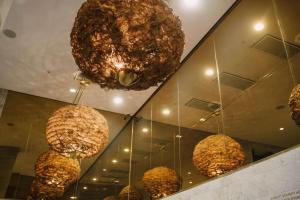 a group of spheres hanging from the ceiling of a building at Best Western Plus Sthlm Bromma in Stockholm