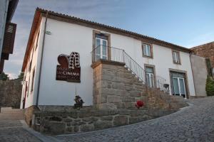 a building with a sign on the side of it at Apartamento do Castelo in Melgaço