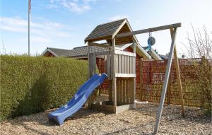 a playground with a slide and a gazebo at Awesome Home In Brkop With 3 Bedrooms, Sauna And Wifi in Brejning