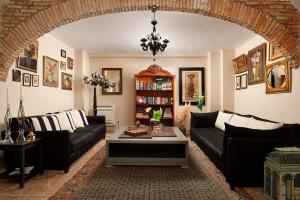 a living room with a couch and a table at Hotel Angelo d'Oro in Rovinj