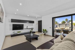 a living room with a couch and a table at Casa Airalba in Tías