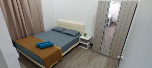 Postel nebo postele na pokoji v ubytování Singgahsini Guesthouse Putrajaya + 10 fotografií