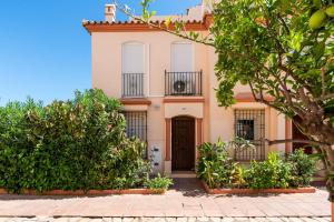 a house in the suburbs with trees in front of it at Belgravia Club Estepona in Estepona