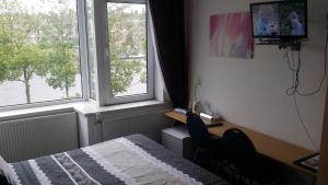 Postel nebo postele na pokoji v ubytování Hotel Baan
