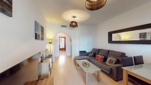 a living room with a couch and a table at Casa Ortosa C-Murcia Holiday Rentals Property in Baños y Mendigo