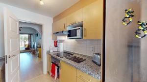 a kitchen with a sink and a counter top at Casa Ortosa C-Murcia Holiday Rentals Property in Baños y Mendigo