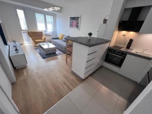 an open kitchen and living room in a apartment at Urban Apartment Skopje in Skopje +24 photos