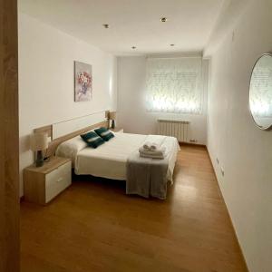 Ліжко або ліжка в номері Apartamento Ronda San Antón