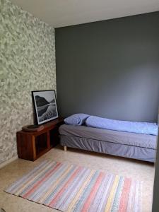 Postel nebo postele na pokoji v ubytování Apartment Matti, Villa Mainiemi