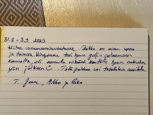 a handwritten letter with handwriting on a document at Moonloft@VillaSolbacka in Inkoo