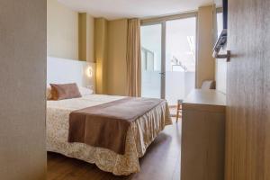 Postel nebo postele na pokoji v ubytování Hotel Best Maritim