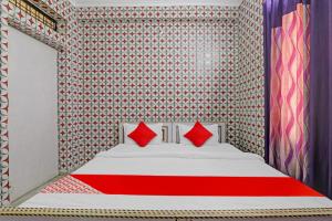 Krevet ili kreveti u jedinici u objektu Flagship Shri Ram Hotel