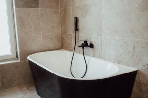 Koupelna v ubytování Fitromax Apartmanház