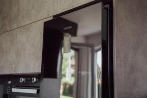 Kuchyň nebo kuchyňský kout v ubytování Fitromax Apartmanház