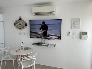 a wall with a flat screen tv on a wall at Blue Sea View in Puerto del Carmen