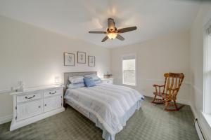 a bedroom with a bed and a ceiling fan at Spacious Loon Lake Retreat Dock and Mtn Views! in Loon Lake