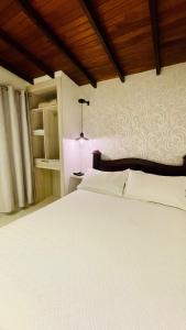 Tempat tidur dalam kamar di 3H HOTEL Av 70