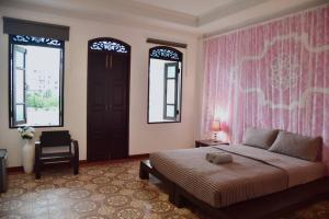 เตียงในห้องที่ Botan Boutique Hotel