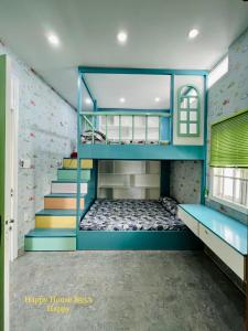 a kids room with a bunk bed and a staircase at Căn Happy in Vung Tau