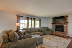 a living room with a couch and a fireplace at Picturesque Page Home Near Lake Powell and Hiking! in Page